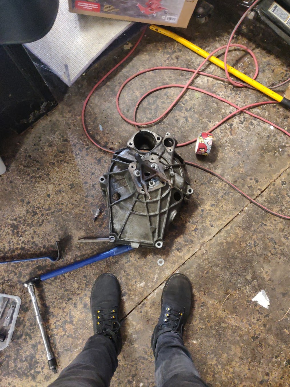 This is the bellhousing and clutch fork, about 5 feet away from where they should be. I had to remove them to do the hardest job on this car I've done yet - changing the clutch. It involved dropping the transmission and driveshaft, removing the entire clutch assembly, and putting it all back together again. I should have taken more pictures, but I had my hands full at that point.